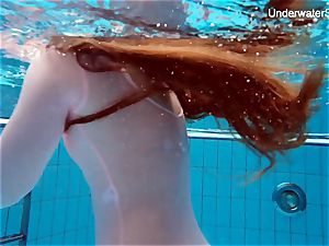 ginger-haired Simonna displaying her bod underwater